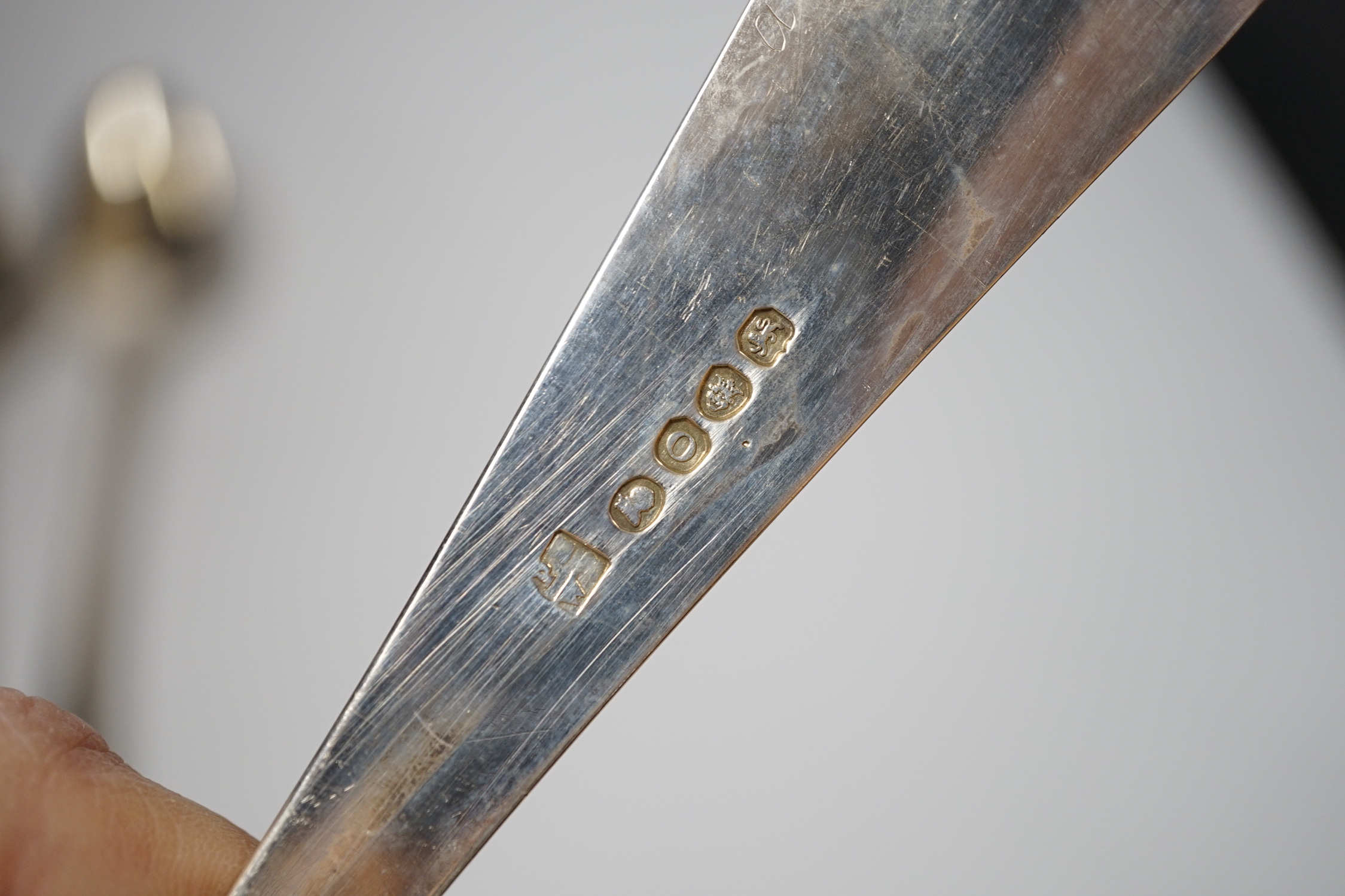 A pair of George III silver beaded Old English pattern basting spoons, George Smith III, London, 1785, 29.5cm and a later silver Old English pattern pair by Peter & William Bateman, 15oz.